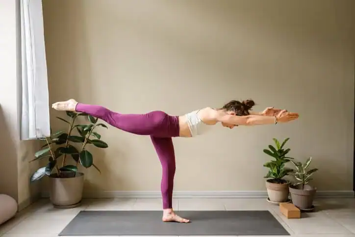 Achieving the Perfect Tone: How Often Should You Exercise for Results? 1 Woman doing Yoga exercise Leicester to help with toning the body.