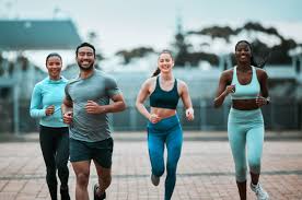 Sculpting Sleek Arms: The Essential Role of Cardio in Toning Without Bulking Up 3 image of people running to incorporate cardio Leicester exercise into their life to help tone arms and body.